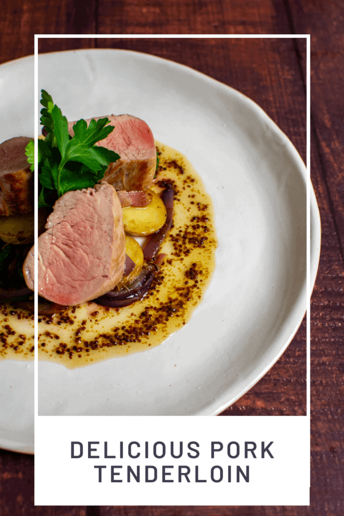 pork tenderloin, vegetables & honey mustard sauce on a white plate