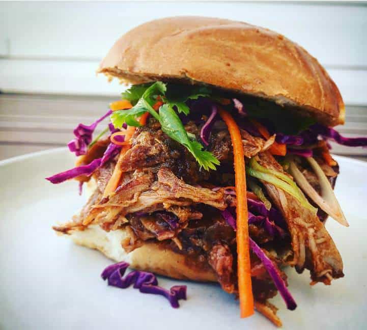 Pulled Pork Sandwich Pulled pork sandwich on a white plate