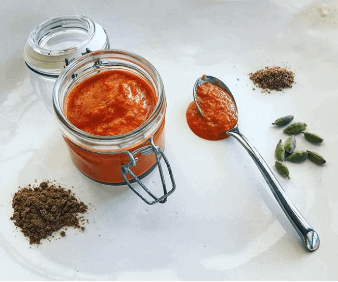 Homemade harissa and spices on a white plate