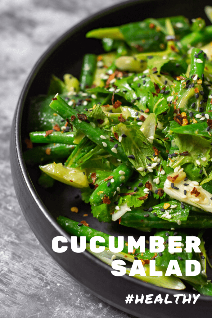 smashed cucumber salad in a black bowl