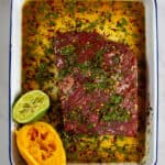 flap steak being marinated carne asada style