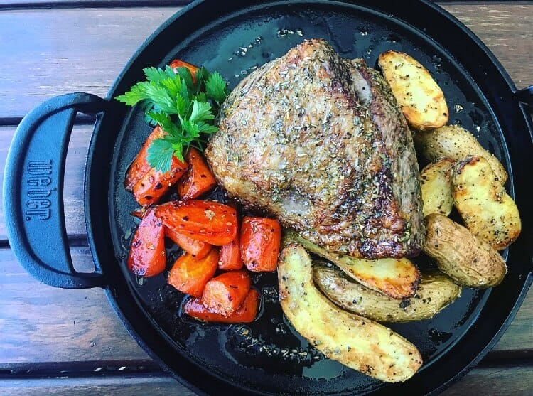 veal roast, carrots & potatoes in a weber cast iron pan