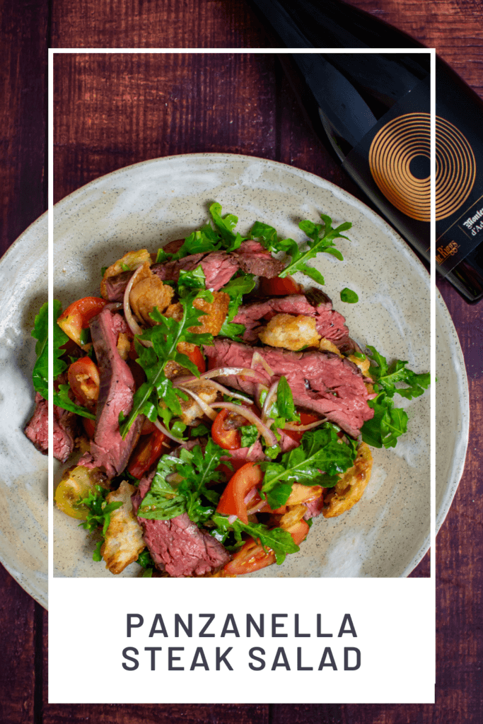 Panzanella steak salad in a bowl with a Mr Riggs Montepulciano wine
