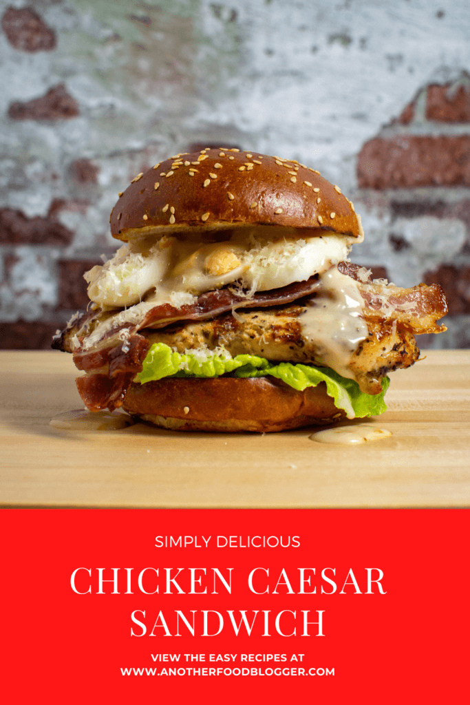 chicken caesar sandwich on wooden chopping board