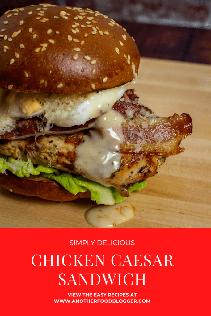 chicken caesar sandwich on wooden chopping board
