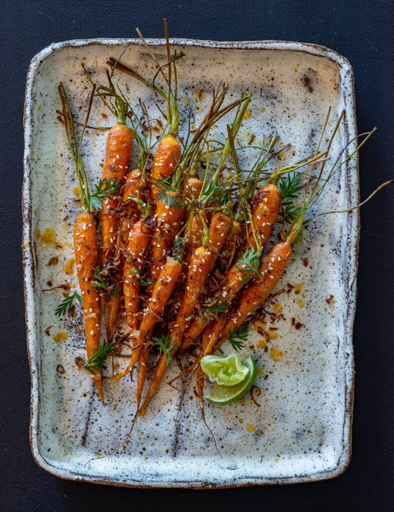 miso maple roased carrots on a serving platter