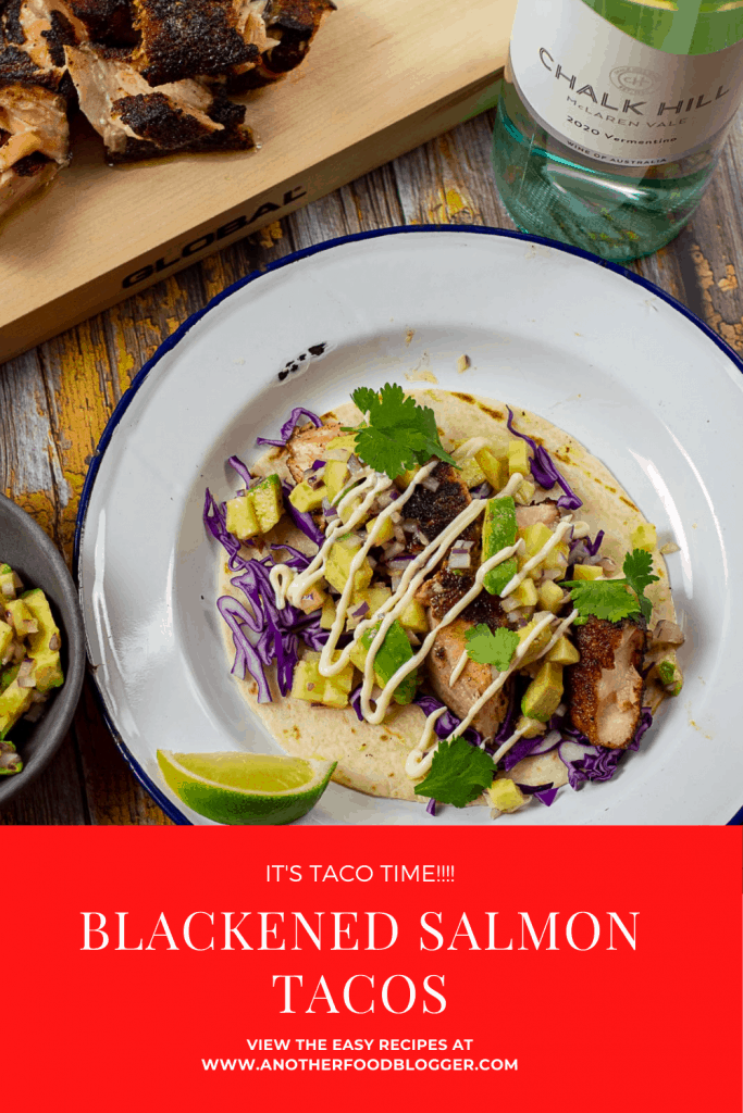 blackened salmon taco on a plate with chalk hill vermentino in background
