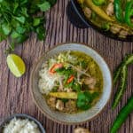 thai green curry in a bowl, coriander, ginger & rice on table