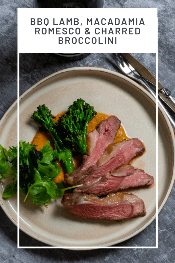 BBQ lamb, romesco sauce & charred broccolini on a plate