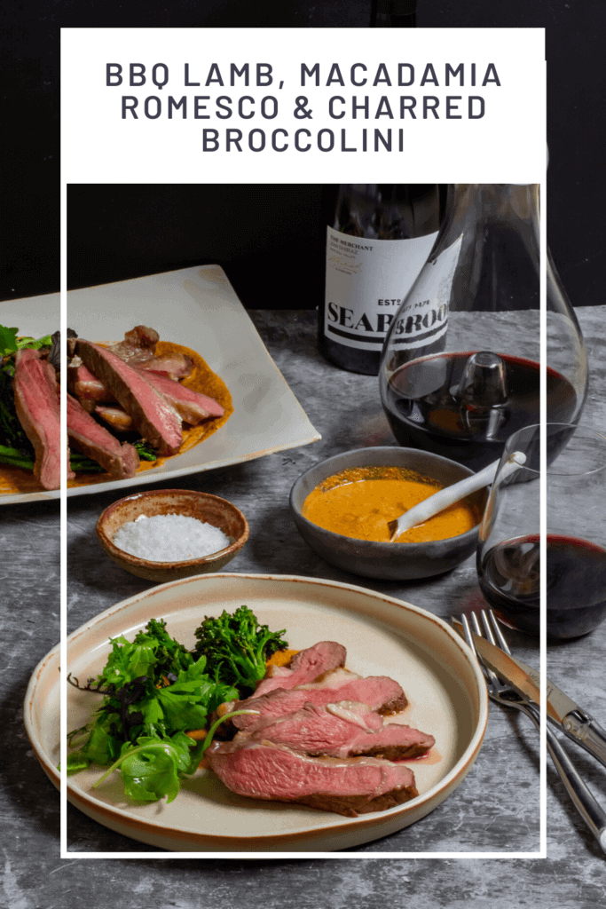 Seabrook wine shiraz, wine decanter, cooked lamb, macadamia romesco sauce & charred broccolini on a table