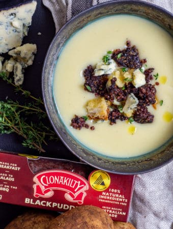 Potato & leek soup with clonakilty black pudding next to it