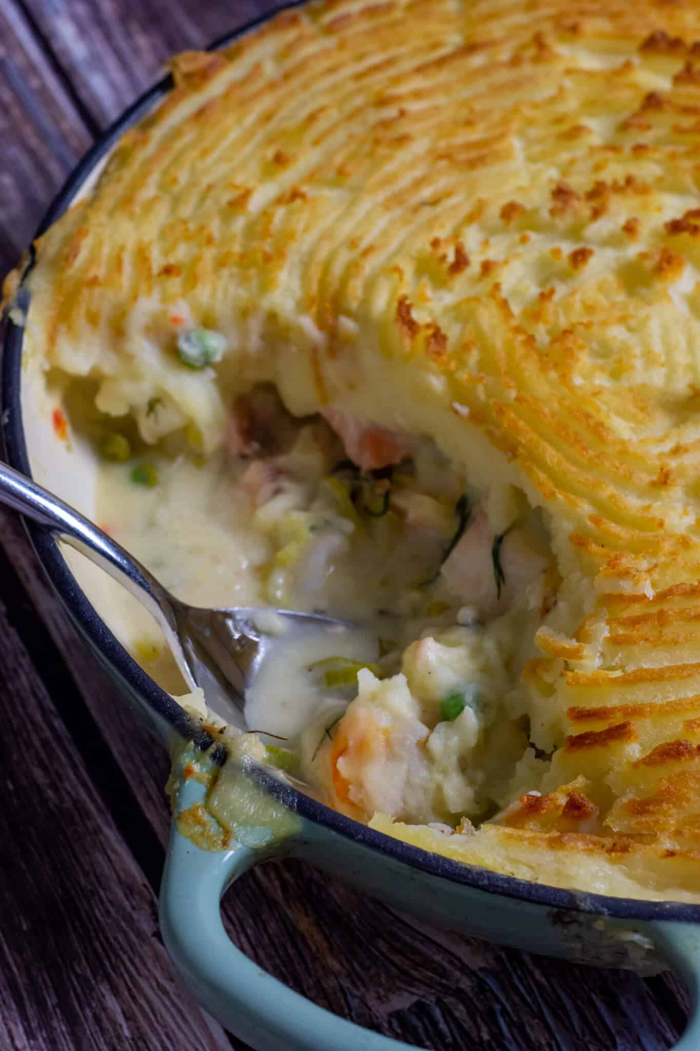 cooked fish pie on wooden board