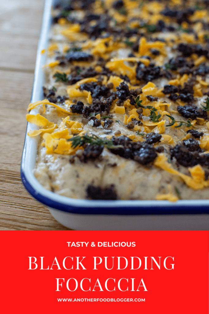 Black pudding focaccia in baking tray on wooden table