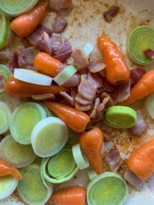 bacon & vegetables cooking in frying pan