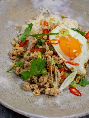 Szechuan fried chicken, rice and fried egg in a bowl