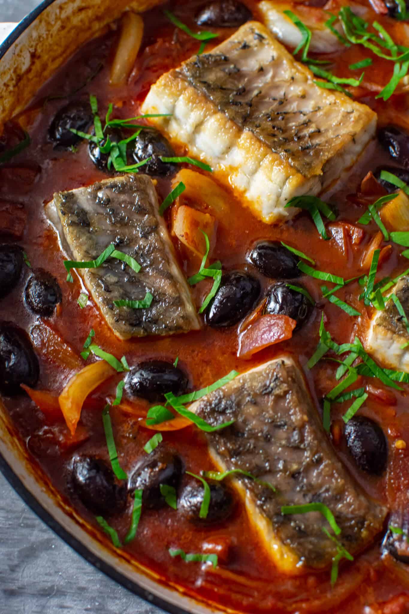 cooked spanish fish stew in casserole dish
