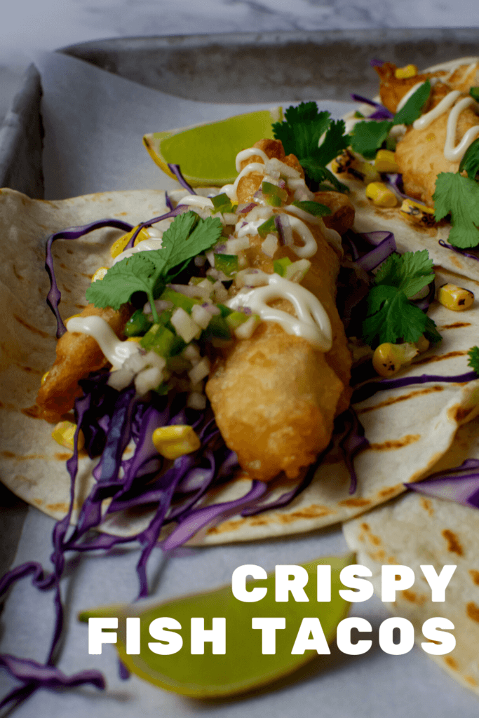 angled photo of a crispy fish taco on a tray
