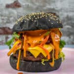 korean beef burger on a pink plate