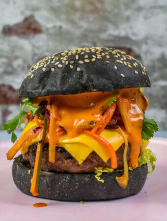 korean beef burger on a pink plate