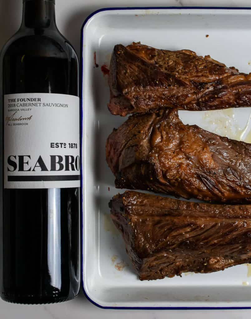 seared short ribs & bottle of seabrook cabernet sauvignon