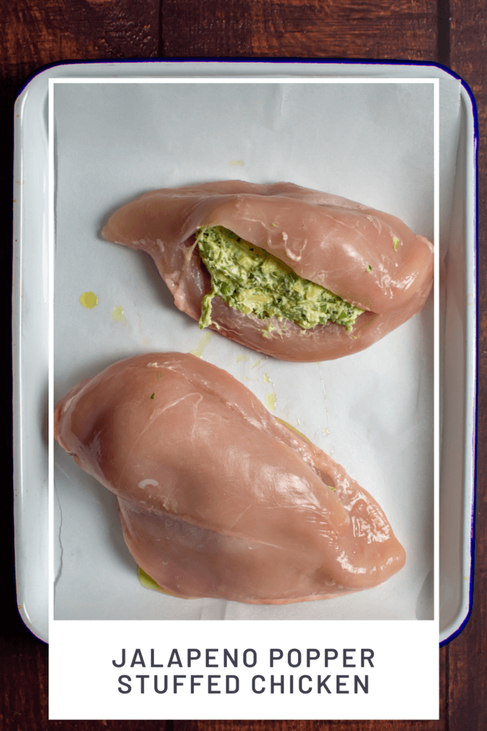 jalapeno popper stuffed chicken on a baking tray