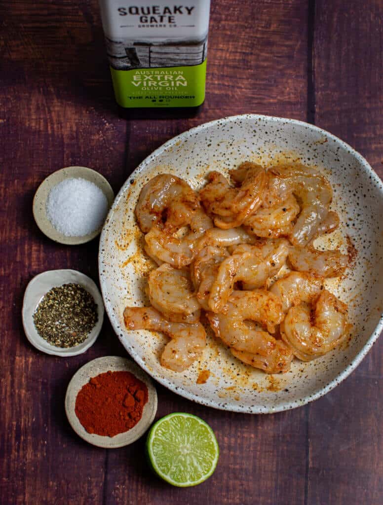 marinated prawns in a bowl, spices and squeaky gate olive oil