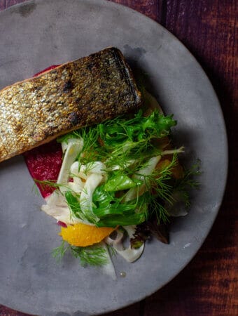grilled salmon, beetroot hummus & fennel salad on a made of australia plate