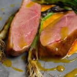 perfectly cooked duck breast, carrot puree & orange sauce on a made of australia plate