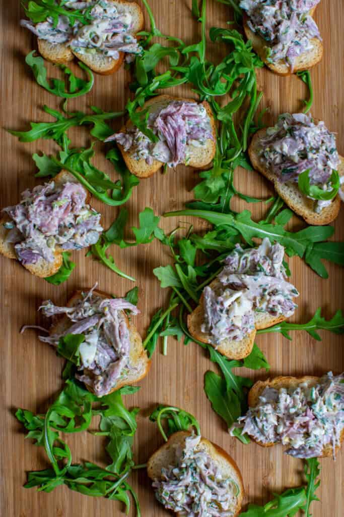 braised ham hock salad on top of crostinis
