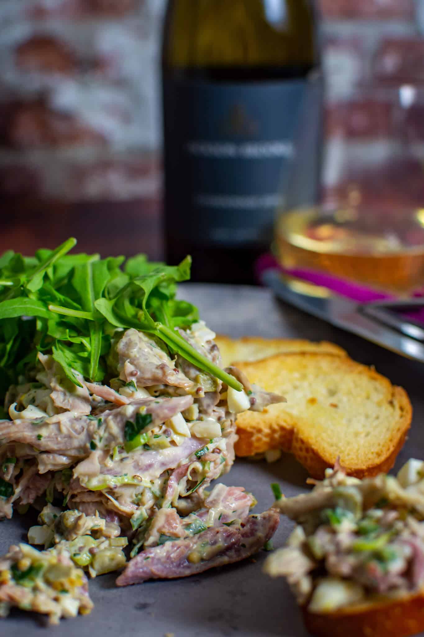 braised ham hock salad on a made of australia plate with jackson brooke chardonnay