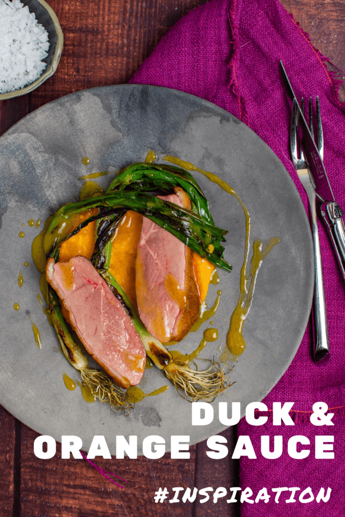 perfectly cooked duck breast, carrot puree & orange sauce on a made of australia plate