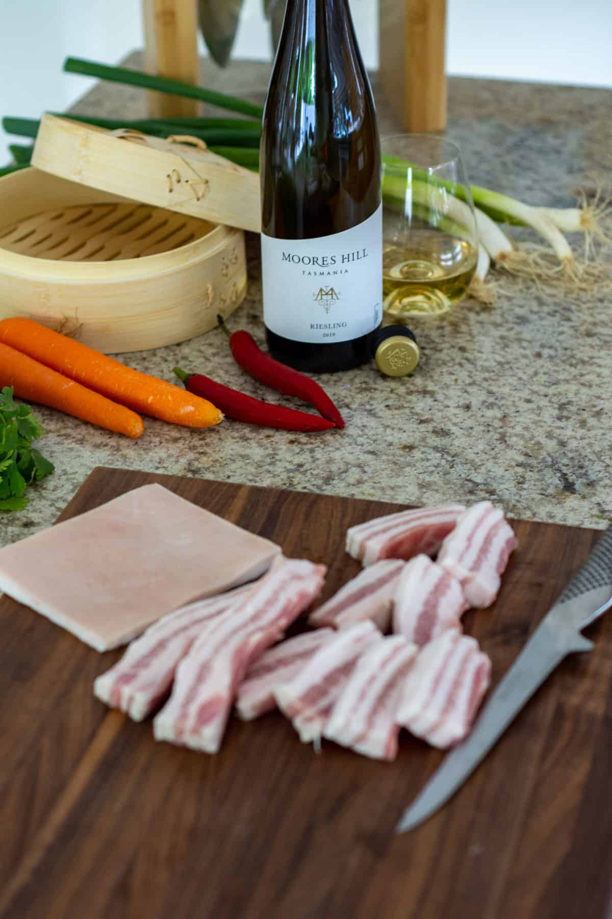 pork bao ingredients, pork belly on a chopping board & moores hill riesling