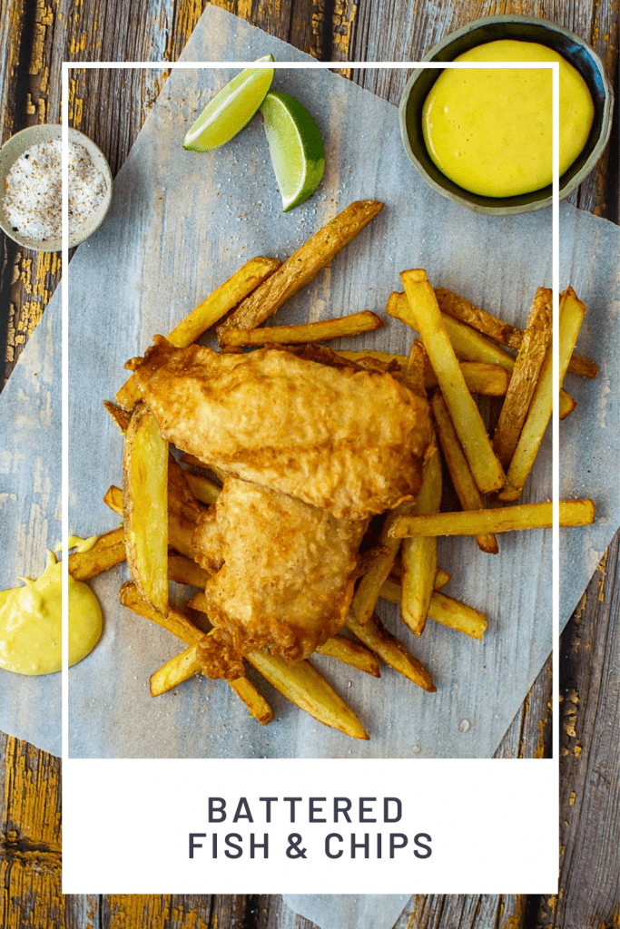 battered fish & chips, aioli & salt on a wooden table