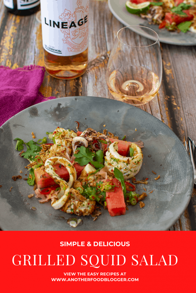 grilled squid salad on a plate with seabrook rose in background