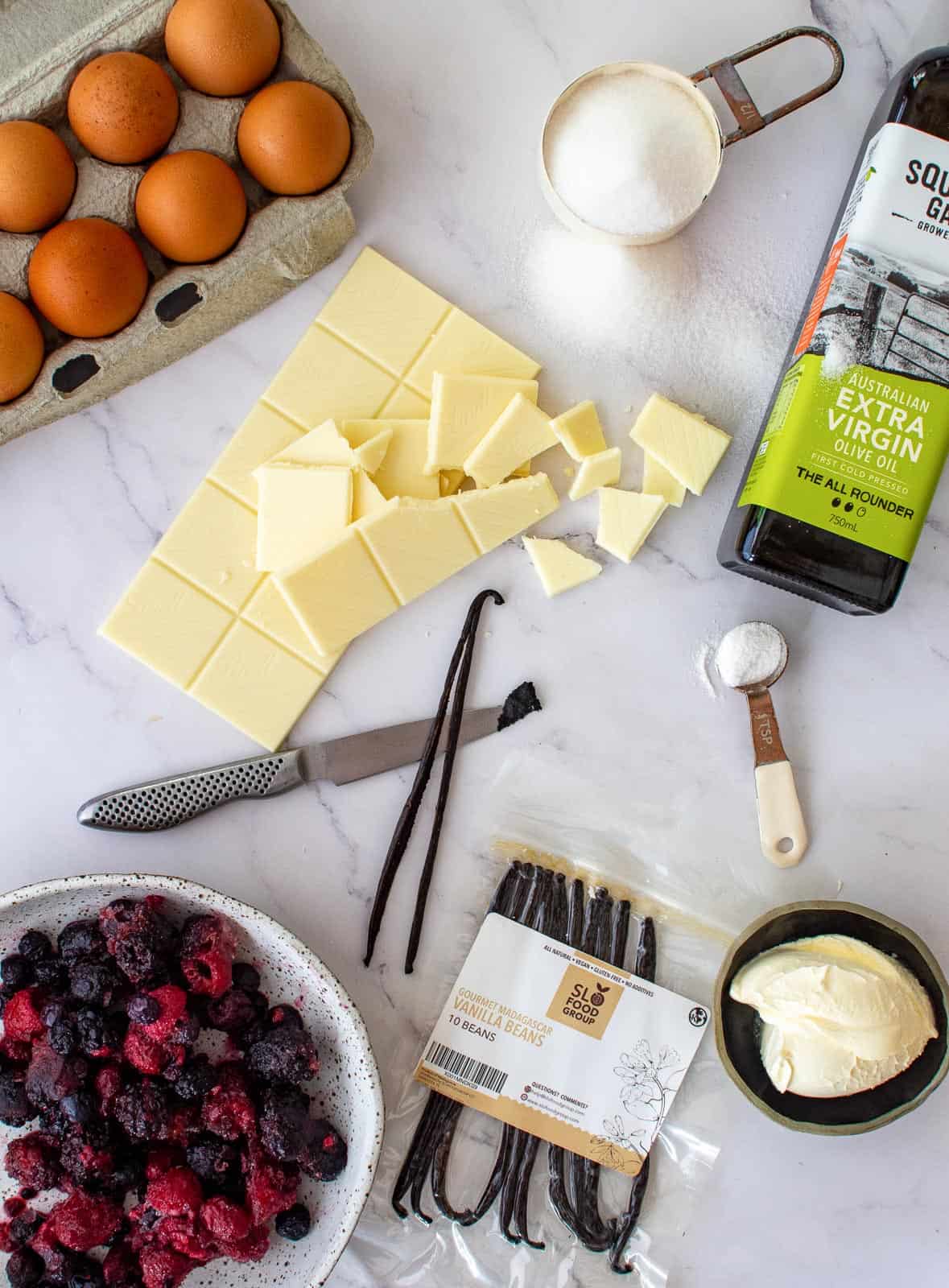 white chocolate & berry muffin ingredients on kitchen counter top