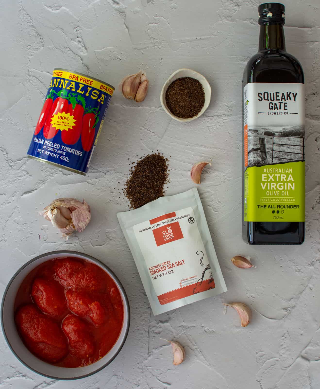 ingredients to make pizza sauce on a counter top