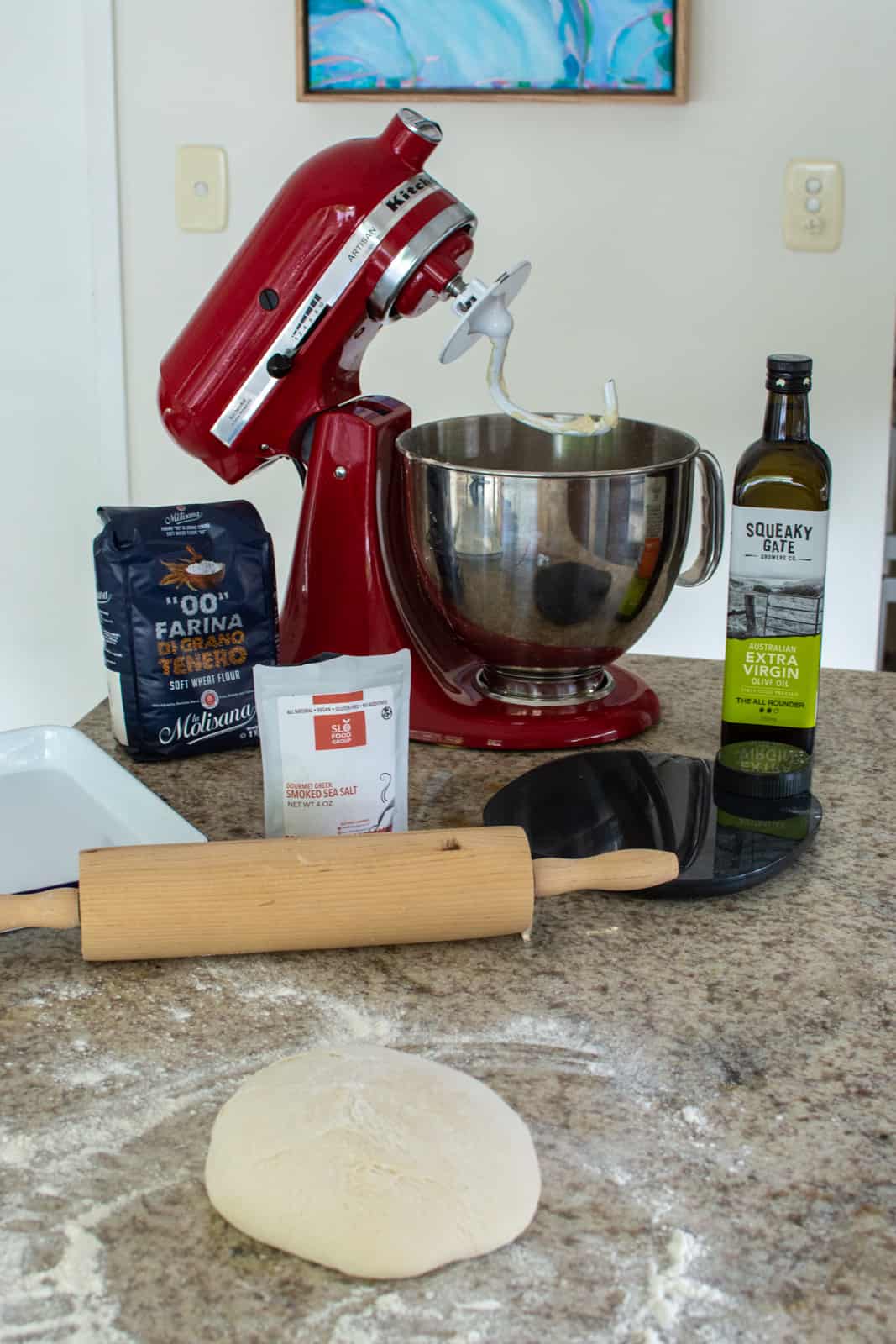 focaccia pizza being amde in a kitchen