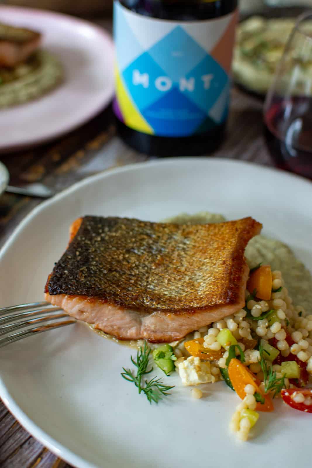 Crispy skin salmon on a bed of baba ghanoush & pearl couscous