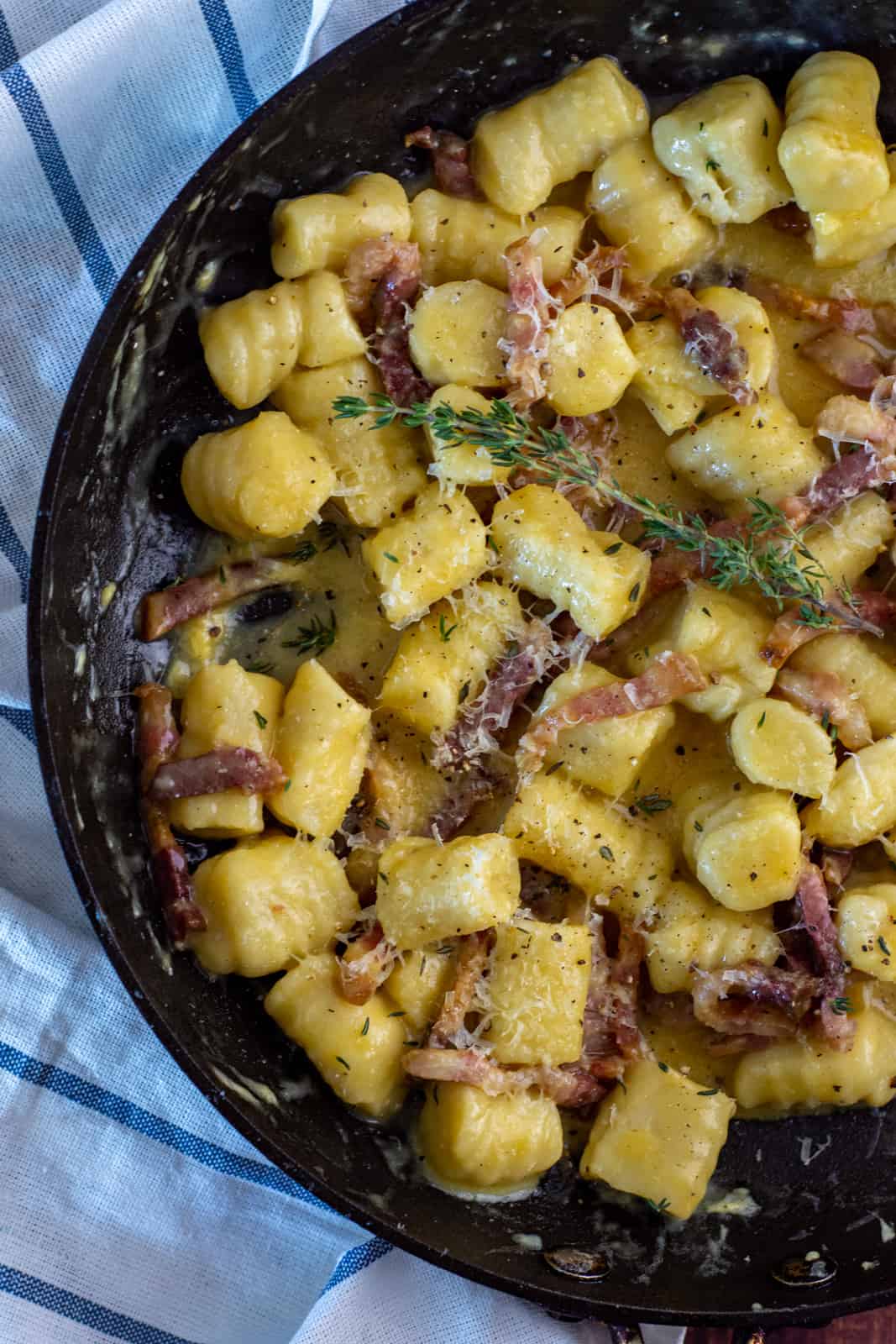 gnocchi carbonara in a frying pan