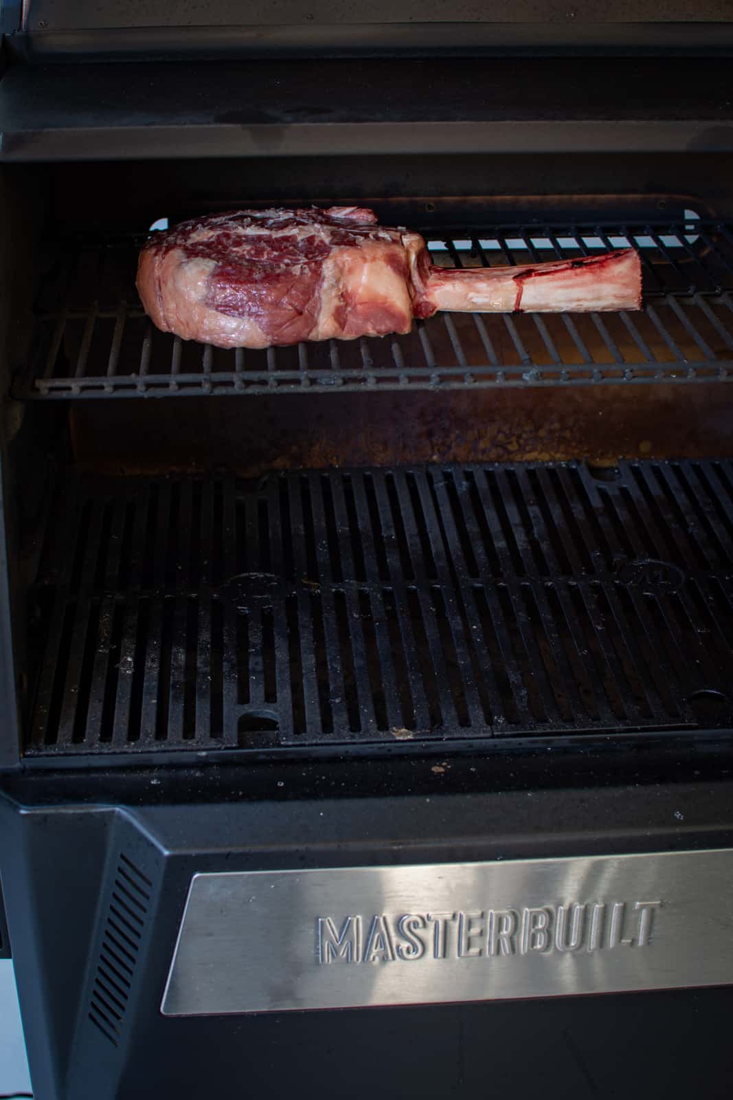 tomahawlk steak on BBQ