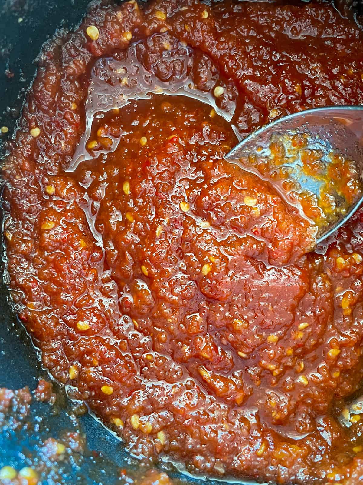 Tomato Chili Jam tomato chilli jam in a saucepan