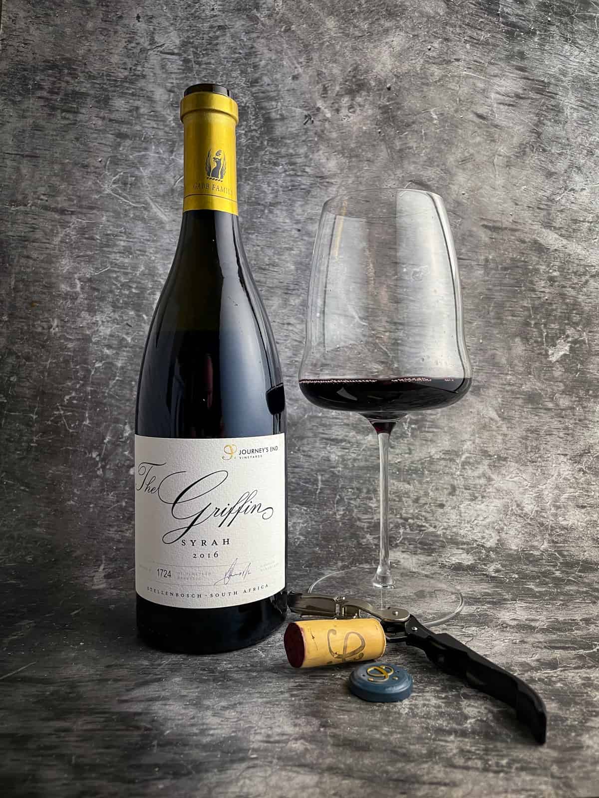 Journeys End Griffin Syrah, wine glass and corkscrew