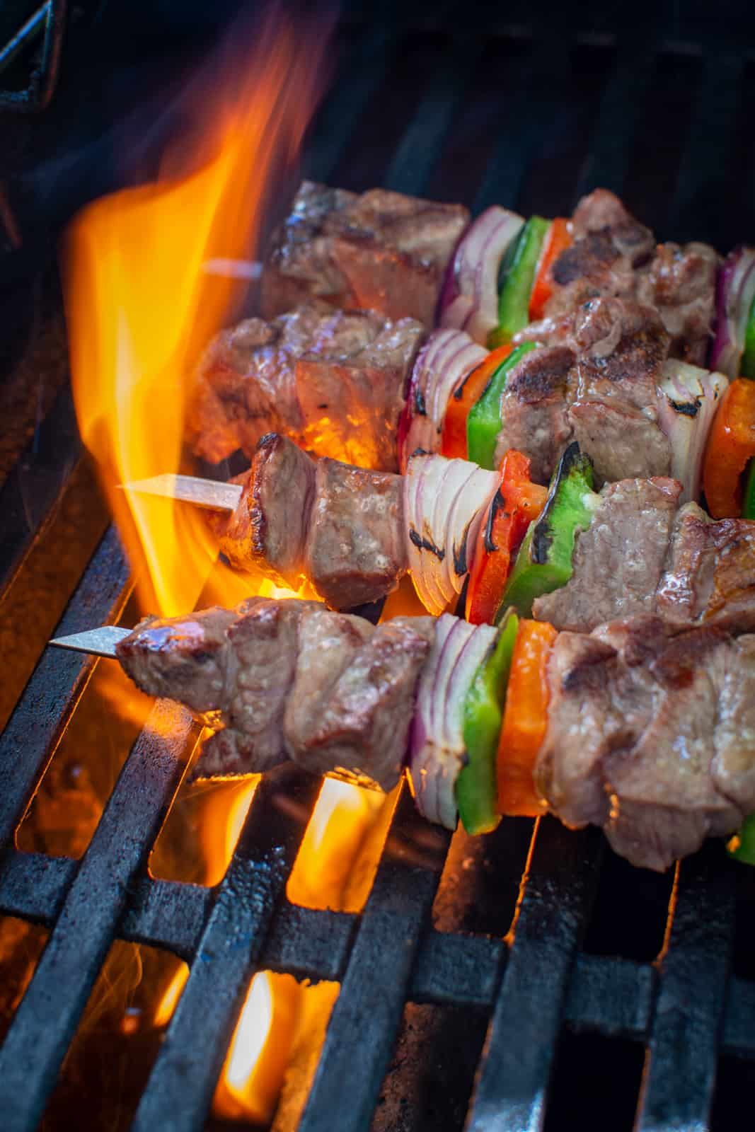 lamb kebabs being grilled on BBQ