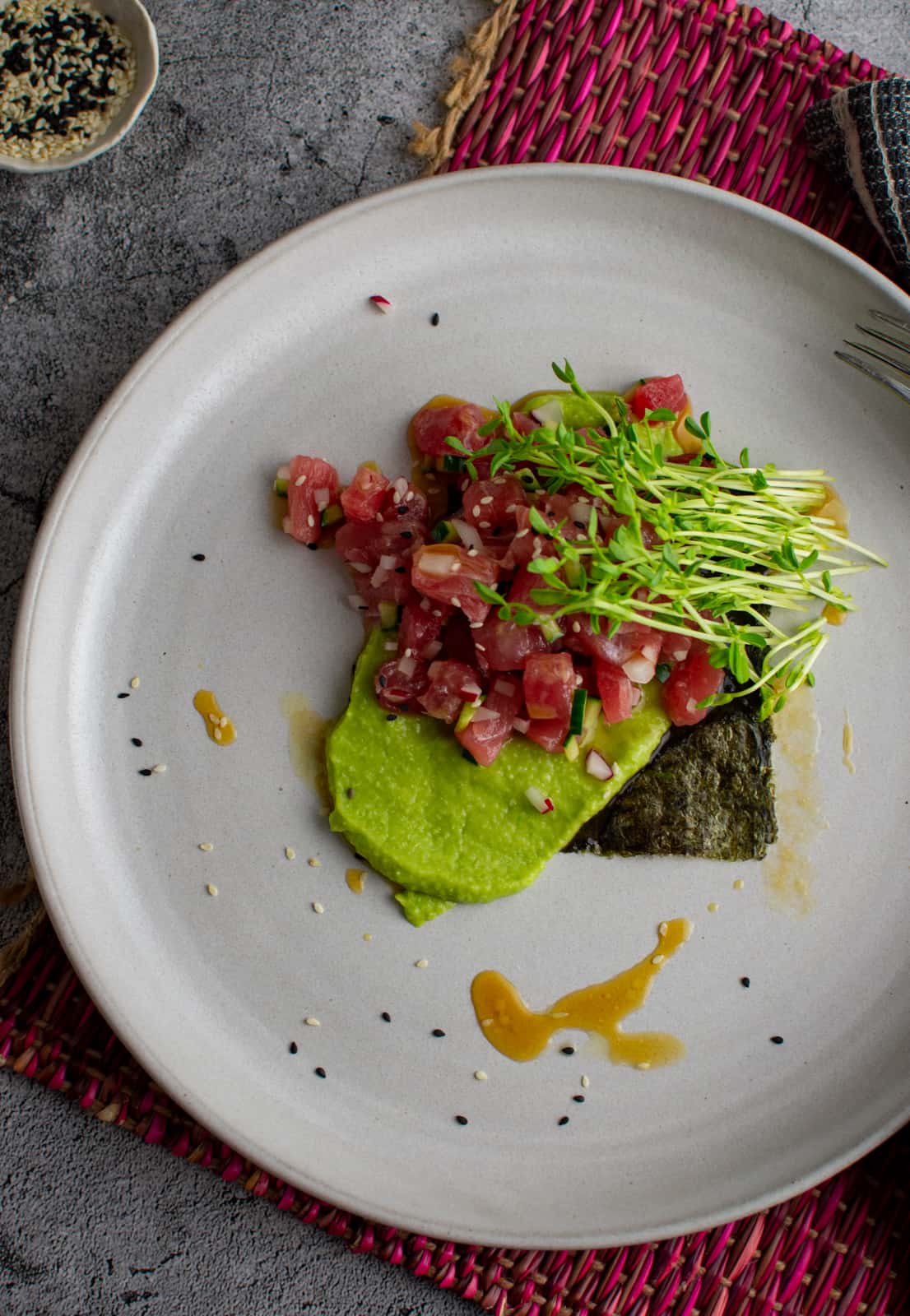 Tuna crudo on a plate on concrete floor