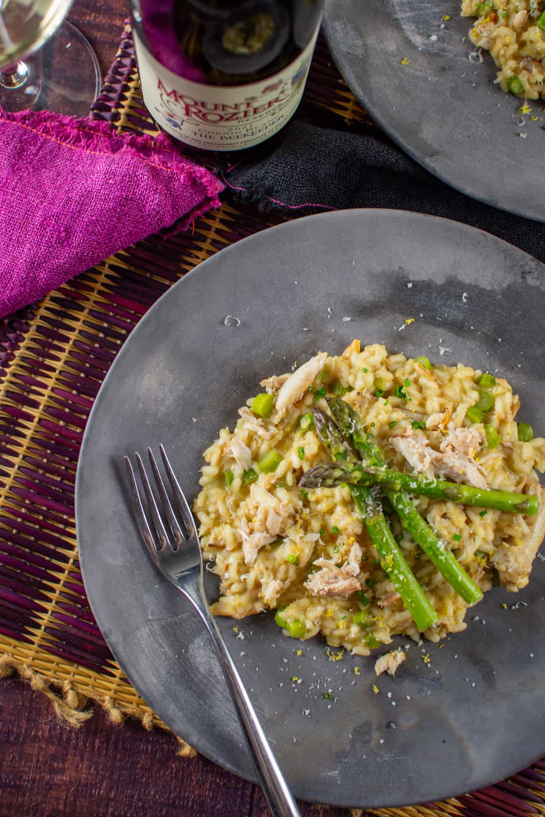 Crab risotto on a plate with Mount Rozier wine next to plate