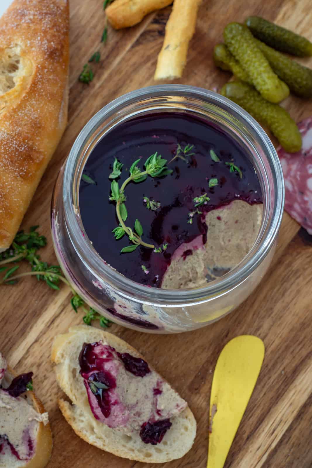simple mushroom pate in a jar with pinot noir jelly and toast next to it