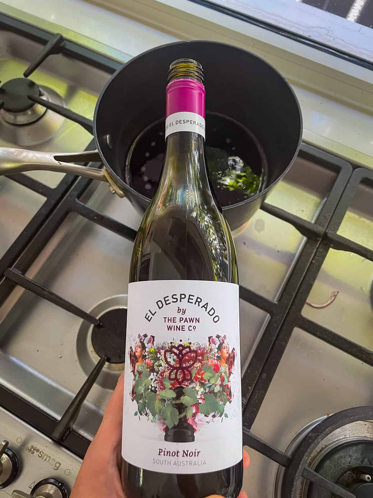 wine being poured into a saucepan