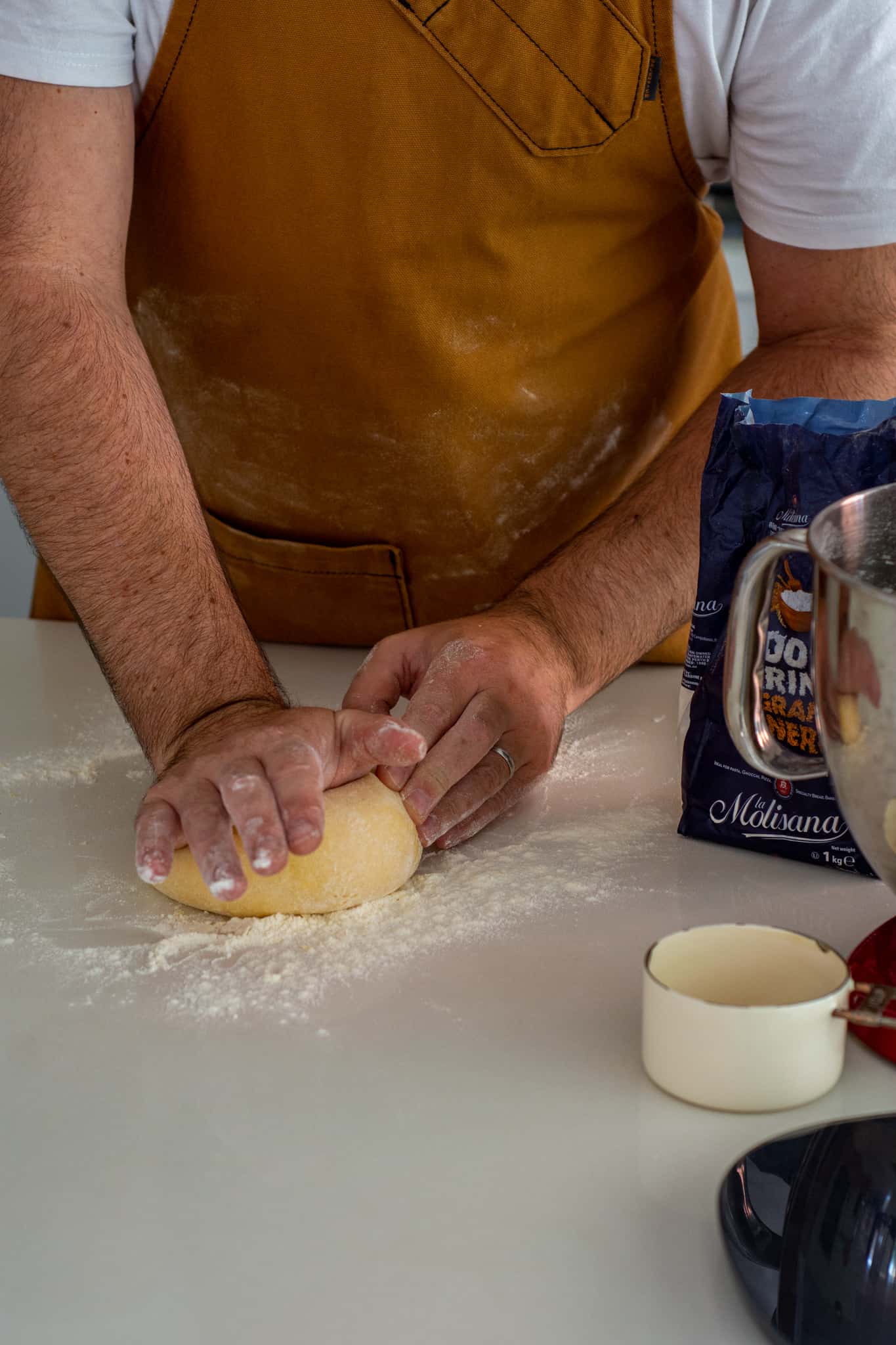 Someone kneading fresh pasta
