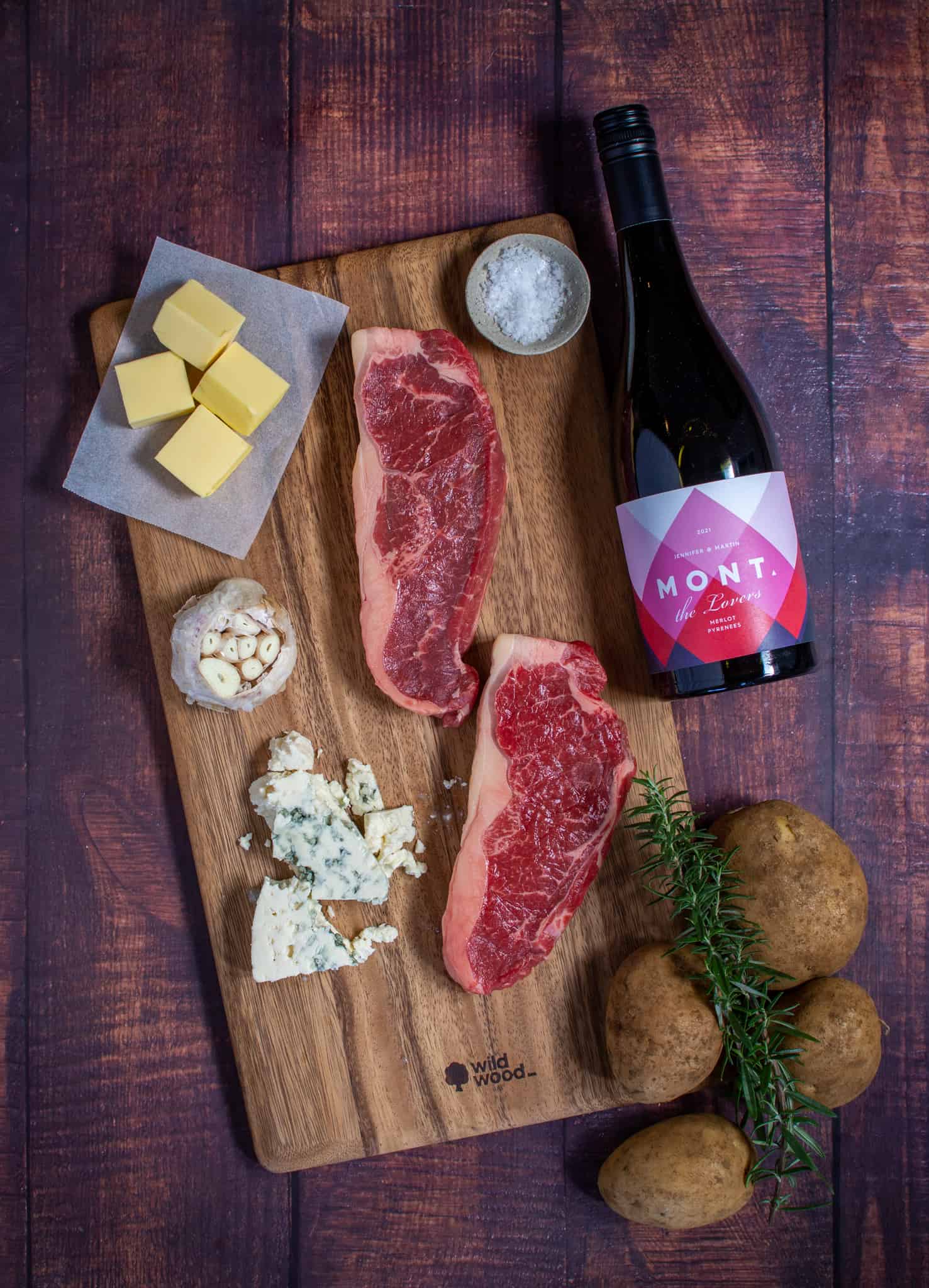 Birdeye view of ingredients for striploin, shoestring fries and blue cheese butter