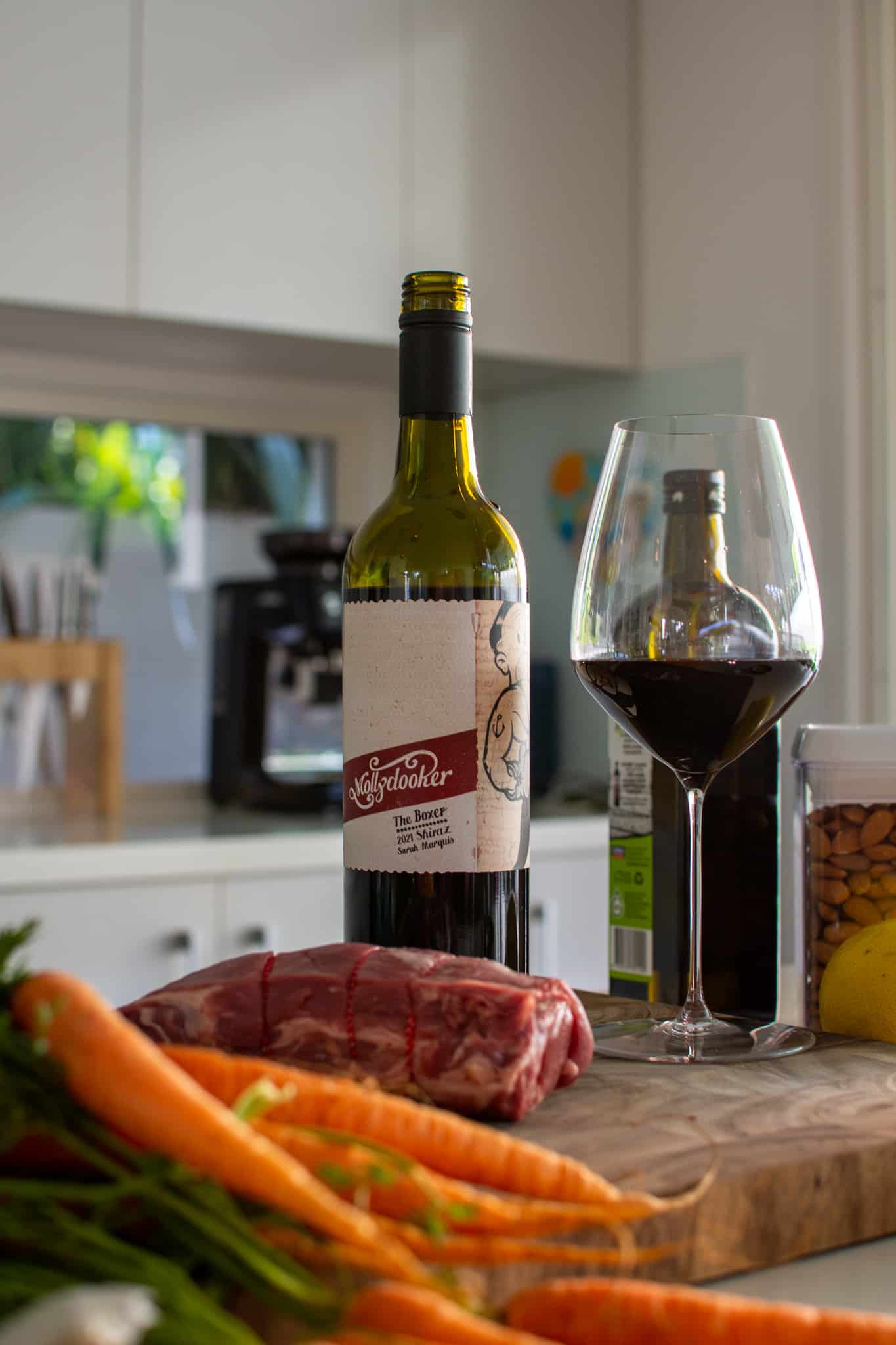 mollydooker shiraz in the kitchen with food beside it